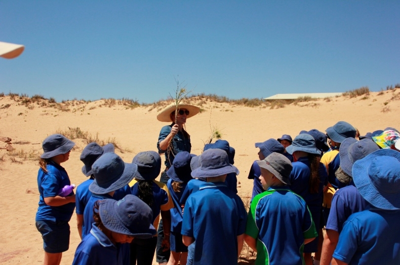 Pip Short with coastal spinifex and Year 4 PHPS students