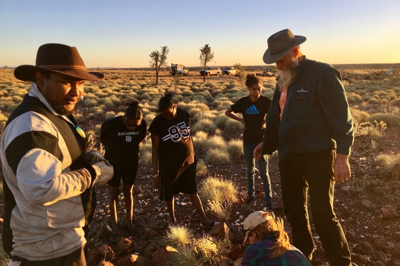 Dave Warren gathering seed alongside pastoral and Indigenous land managers.