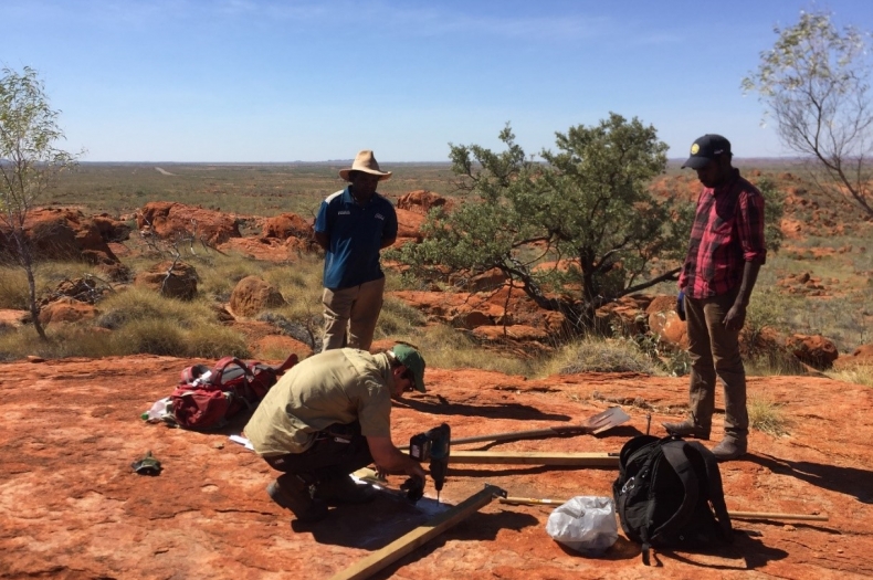 Researcher Harry Moore setting up a monitoring camera with Ranger’s John Stewart and Nathaniel Herbert looking on. Individual animals are identified by their spots.