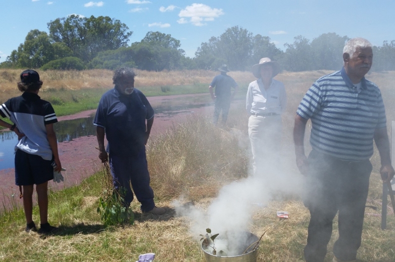 Elder Harry Nannup conducting a Smoking Ceremony to bless works on the Serpentine River