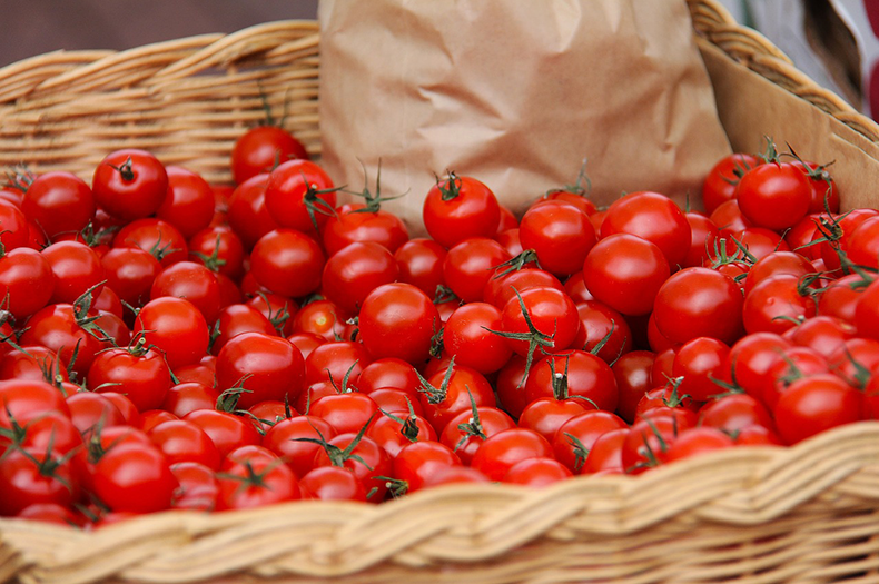 A basket full of cherry tomatoes.
