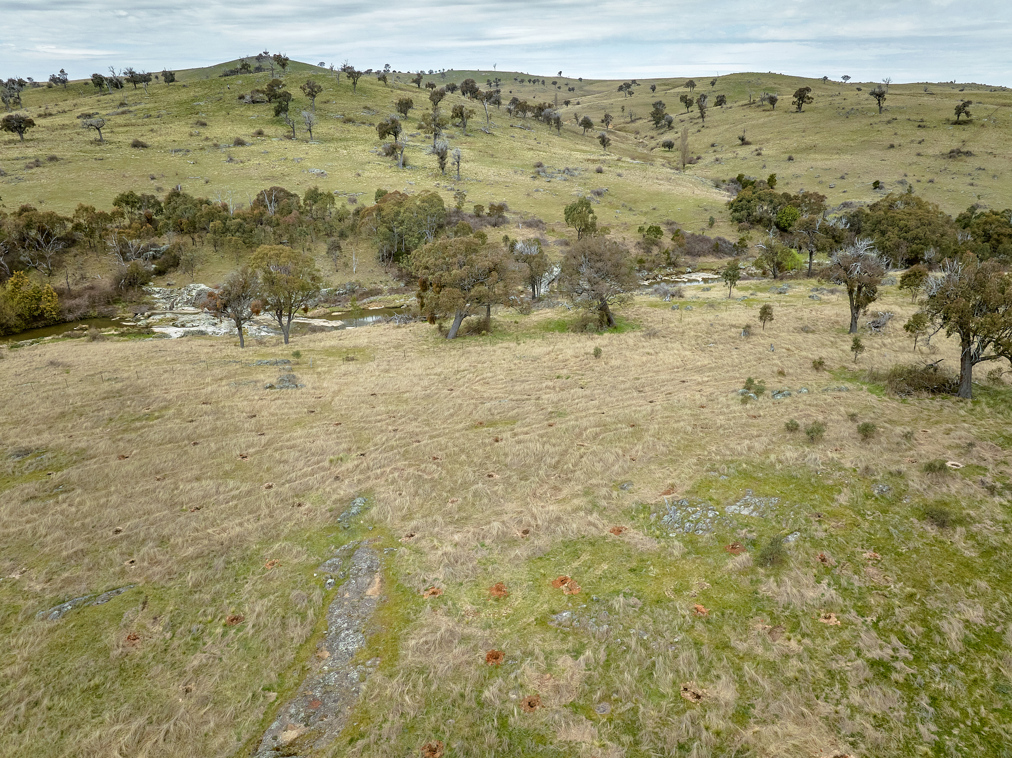 An aerial view of a cleared landscape with a river running through it